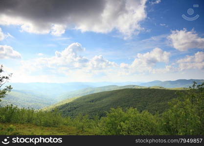 Hills beautiful summer landscape in the mountains blue sky with clouds Bieszczady Poland