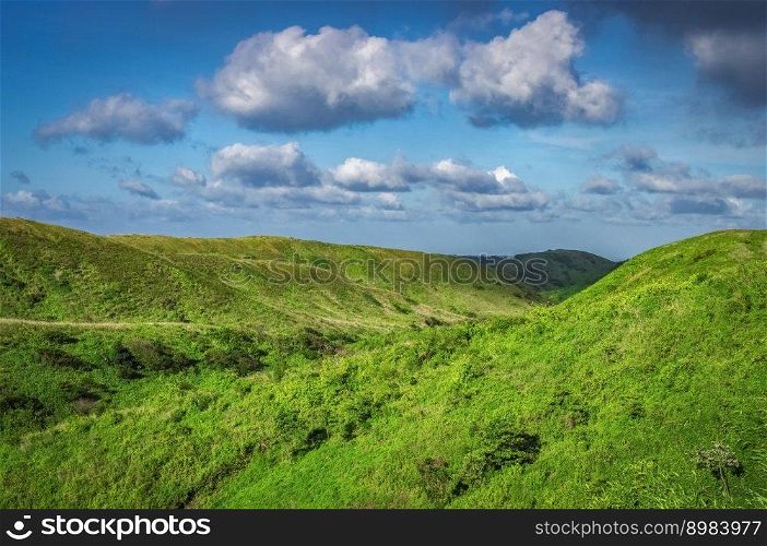 Hills with clouds and blue sky, hills and blue sky with copy space