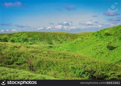 Hills with clouds and blue sky, hills and blue sky with copy space