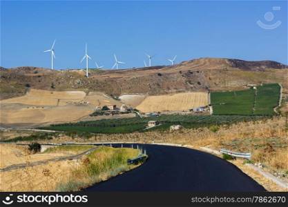 hilly landscape where there is a wind power plant
