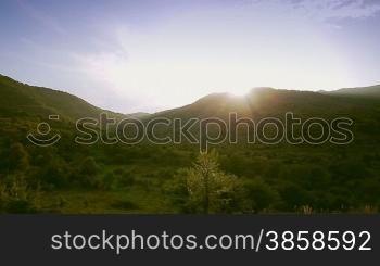 Hilly terrain, countryside landscape in springtime, vehicle shot