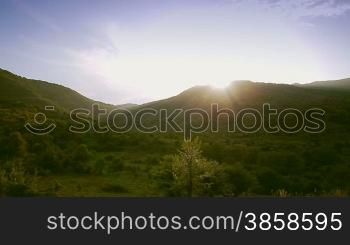 Hilly terrain, countryside landscape in springtime, vehicle shot