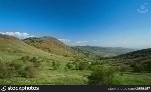 Hilly terrain, countryside landscape in springtime, vehicle shot, Macedonia
