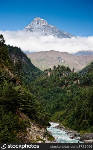 Himalaya mountains Landscape: peak, stream and forest. Travel to Nepal