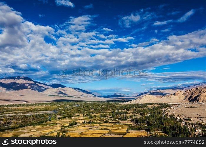 Himalayan landscape of historic Indus valley surrounded by Karakoram range of Himalaya mountains. View from Buddhist temple Thiksey gompa. Ancient civilization of Bronze Age South Asia. Ladakh, India. Himalayan landscape of Indus valley surrounded by Karakoram range Himalaya mountains. Ladakh, India