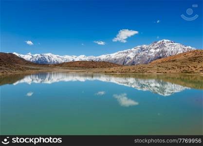 Himalayas mountains refelcting in mountain lake Dhankar Lake. Spiti Valley, Himachal Pradesh, India. Dhankar Lake. Spiti Valley, Himachal Pradesh, India