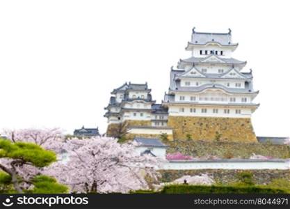 Himeji Castle and sakura blossom with white sky in Himeji, Japan