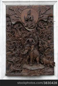 hindu art panel made from wood in temple on Bali