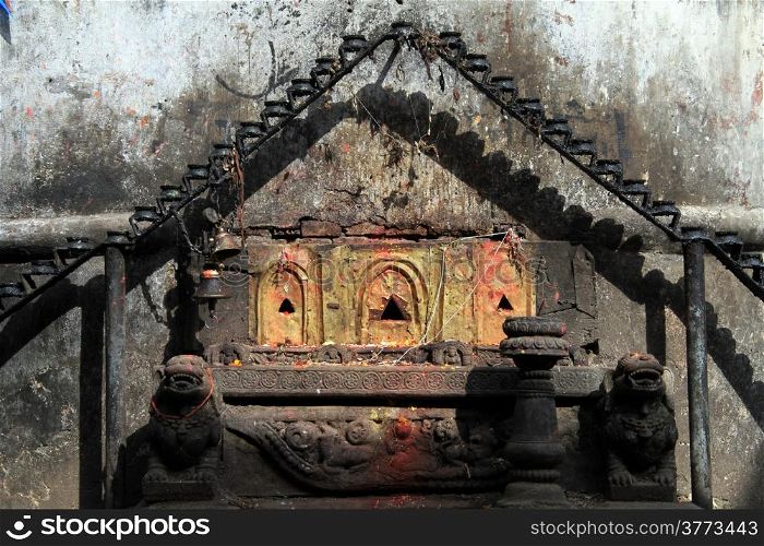 Hindu shrine and wall of temple in Bhaktapur, Nepal
