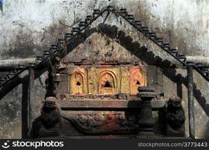 Hindu shrine and wall of temple in Bhaktapur, Nepal
