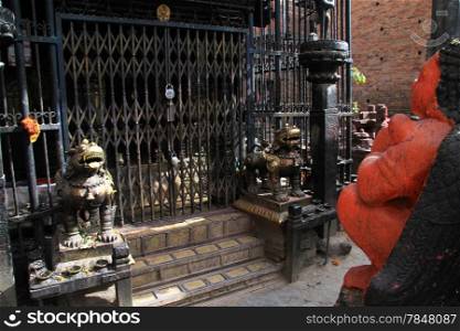 Hindu temple and bronze lion in Bhaktapur, NepaL