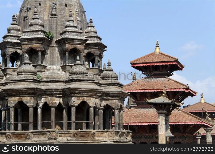 Hindu temple and roofs of pagoda on the Durbar square in Patan, NepalTemples in Patan