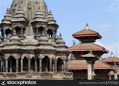 Hindu temple and roofs of pagoda on the Durbar square in Patan, NepalTemples in Patan