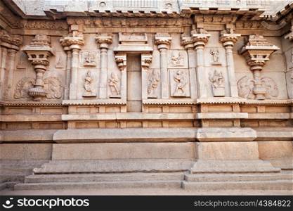 Hindu temple wall with ornate carving, Asia