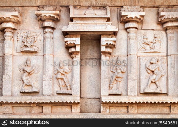 Hindu temple wall with ornate carving, Asia