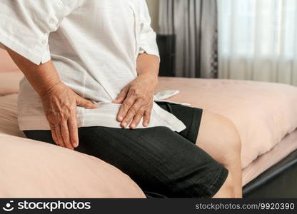 Hip pain of senior woman at home, healthcare problem of senior concept