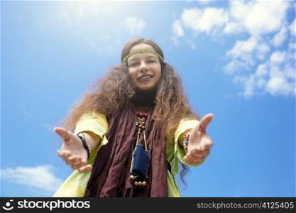 hippie girl on blue sky background, sunny light f/x, focus point on face