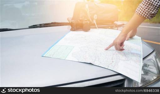Hipster Asian woman backpacker . Hipster Asian woman backpacker look map on trip