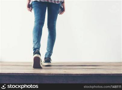 hipster cool woman feet with black sneakers, soft vintage toned . hipster cool woman feet with black sneakers, soft vintage toned colors.