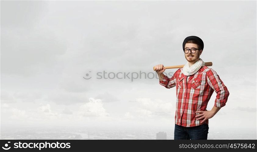Hipster guy with bat. Hipster guy in checked shirt and hat with baseball bat