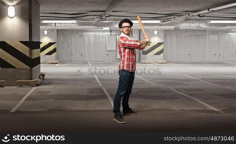 Hipster guy with bat. Hipster guy in checked shirt and hat with baseball bat. Mixed media