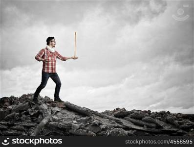 Hipster guy with bat. Young hipster guy with bat on hill top