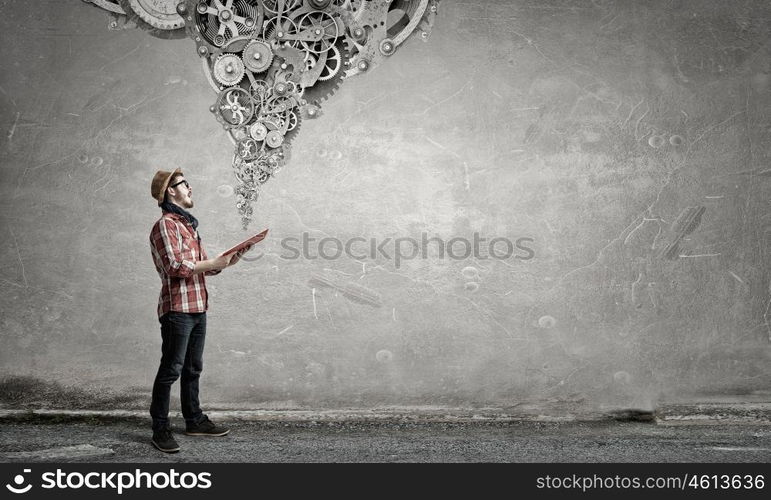 Hipster guy with book. Hipster guy with book in hands and gear mechanism