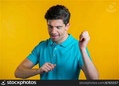 Hipster man dancing positive on yellow studio background. Handsome male model guy. Party, happiness, freedom, youth concept. Hipster man dancing positive on yellow studio background. Handsome male model guy. Party, happiness, freedom, youth concept.