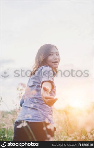 Hipster young woman guiding traveler into the field.