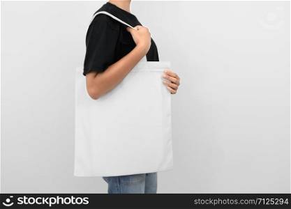 hipter woman holding eco fabric bag isolate on white background