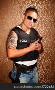 Hispanic Cop Holding Gun