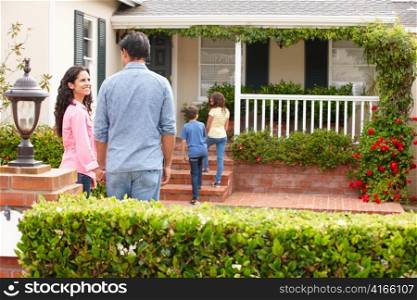 Hispanic family outside home for rent