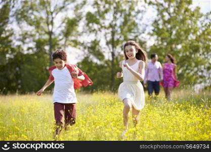 Hispanic Family Walking In Countryside
