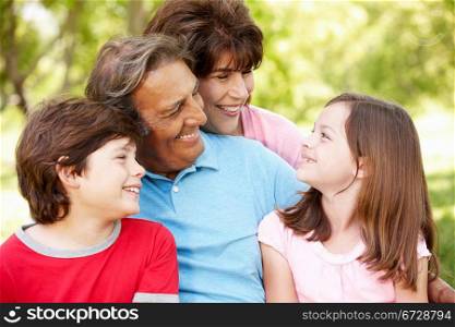 Hispanic grandparents and grandchildren outdoors