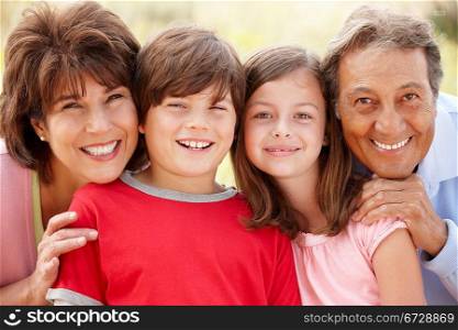 Hispanic grandparents and grandchildren outdoors