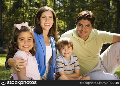 Hispanic outdoor family portrait.