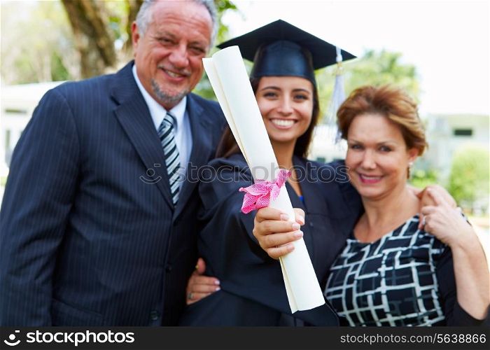 Hispanic Student And Parents Celebrate Graduation