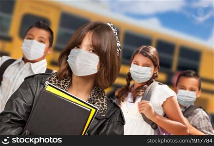 Hispanic Students Near School Bus Wearing Medical Face Face Masks