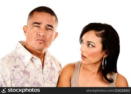 Hispanic wife looks suspiciously at her husband