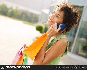 hispanic woman with shopping bags