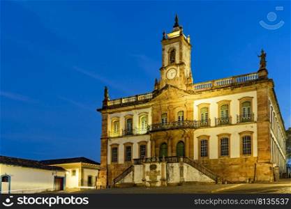 Historic building in Baroque style at dusk in the central square of the city of Ouro Preto in Minas Gerais, Brazil. Historic building in Baroque style at dusk