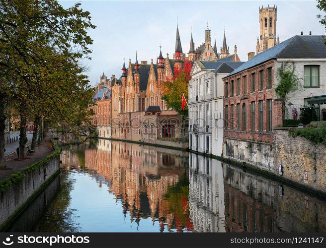 Historic buildings of Bruges with reflection in the canals, Belgium