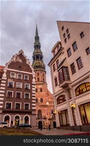 Historic center of Riga with old and modern buildings and Saint Peter church in the background, Latvia