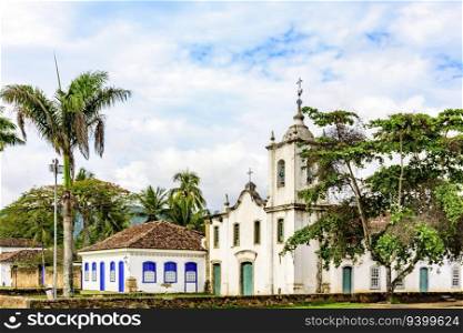 Historic church and houses on historic street in the city of Paraty on the coast of the state of Rio de Janeiro. Church and houses on historic street in the city of Paraty