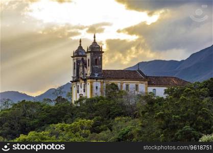 Historic church on top of the hill during sunset in the historic city of Ouro Preto in Minas Gerais, Brazil. Historic church on top of the hill during sunset