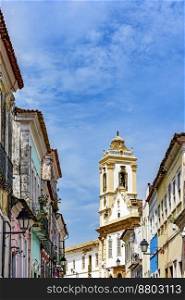 Historic church tower between the colorful houses in the famous Pelourinho neighborhood in Salvador Bahia. Historic church tower between the colorful houses in the Pelourinho