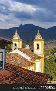 Historic church towers with the mountains in the background in the city of Ouro Preto in Minas Gerais. Historic church towers with the mountains