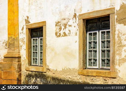 Historic church windows in colonial style with rustic stone frame in the ancient city of Ouro Preto in Minas Gerais, Brazil. Historic church windows in colonial style with rustic stone frame