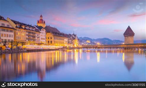 Historic city center of downtown Lucerne with Chapel Bridge and lake Lucerne in Switzerland at sunset