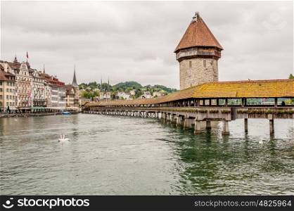 Historic city center of Lucerne with Chapel Bridge and lake Lucerne under dramatic sky, Canton of Lucerne, Switzerland